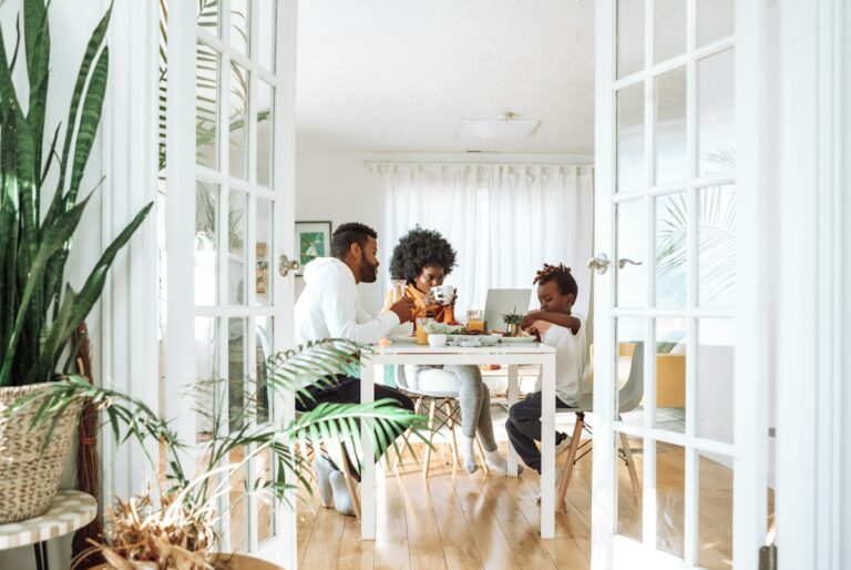 Family gathered together around a dining table.