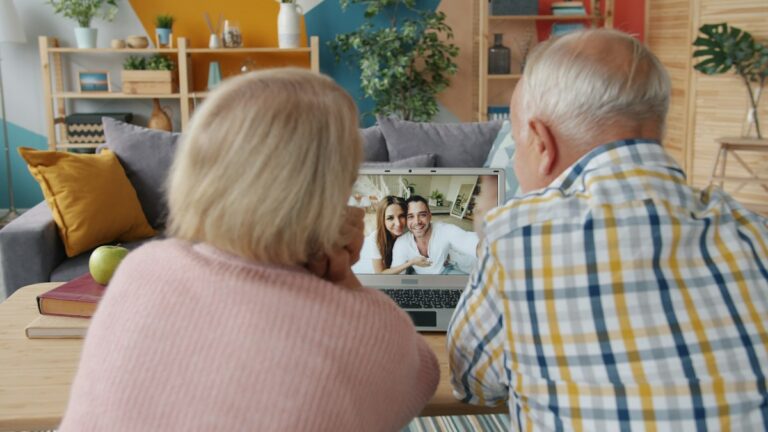 Family members connecting and offering support through a video call.